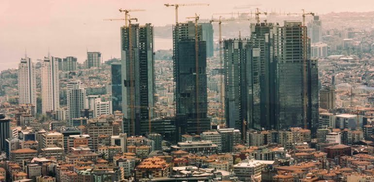 Istanbul skyscrapers, crane working in construction site, building and carrying