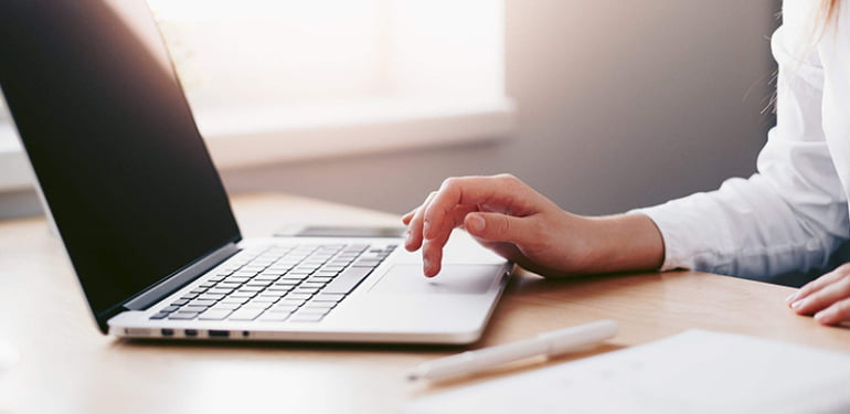 business-woman-working-on-laptop-in-her-office-2210x1473-1