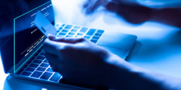 concept-credit-card-theft-hackers-with-credit-cards-laptops-use-these-data_29110-84