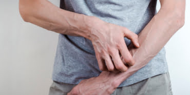 concept-scabies-man-scratches-his-arm-irritation-drying-skin_8119-1115