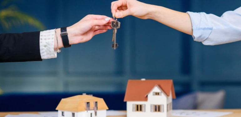 female-realtor-giving-key-from-new-flat-house-female-clients_141188-2017