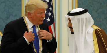 Saudi Arabia's King Salman presents Trump with the Collar of Abdulaziz Al Saud Medal at the Royal Court in Riyadh