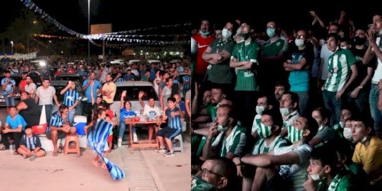 Koronavirüs nedeniyle stada alınmayan taraftarlar dışarıda iç içe maç izledi