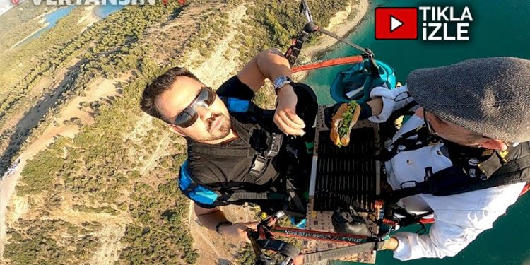 Yamaç paraşütünde hamburger pişirip yediler