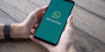 man-holding-smartphone-with-open-whatsapp-screen_89286-43