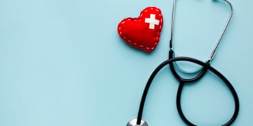 top-view-minimalist-red-heart-with-stethoscope_23-2148439066