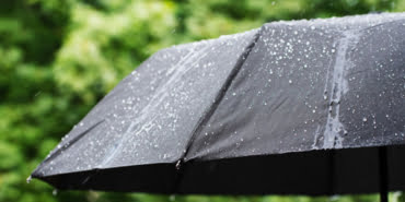 umbrella-rain-drops-closeup_196038-157